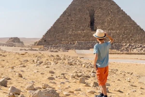 Child exploring the Great Pyramid of Giza.