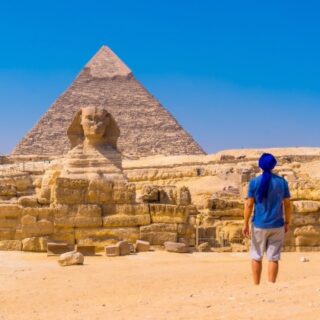 Person gazing at the Sphinx and pyramid