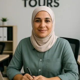 Woman at desk in a travel agency office.