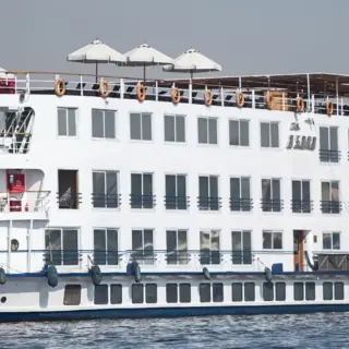 Luxurious riverboat with multiple balconies.